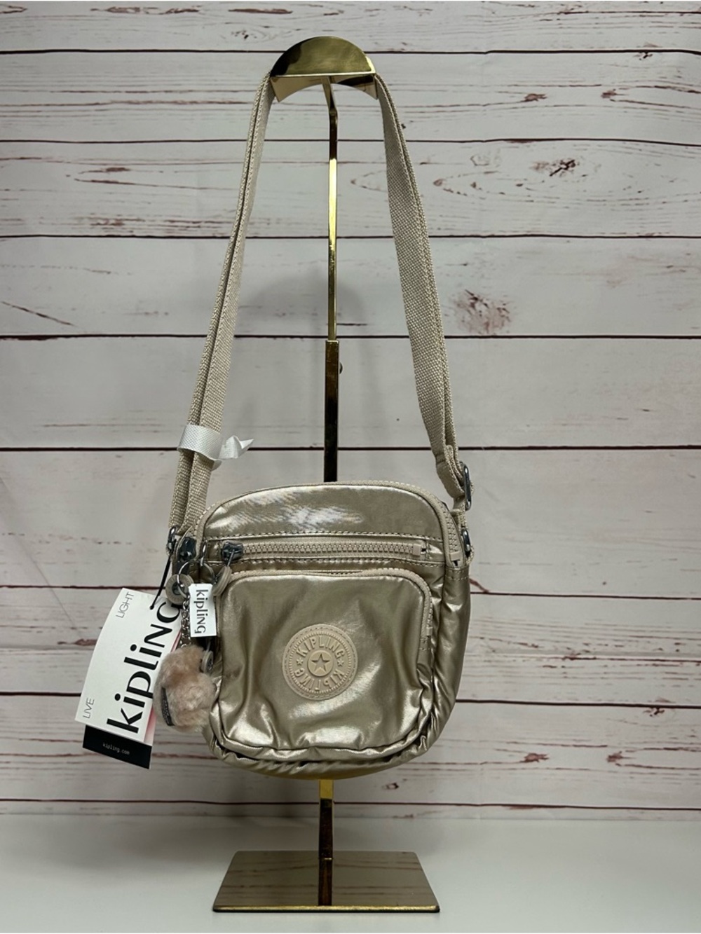 Kipling Metallic Champagne Crossbody Bag with Plush Charm